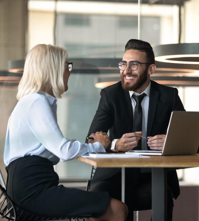 A happy advisor speaking with a client