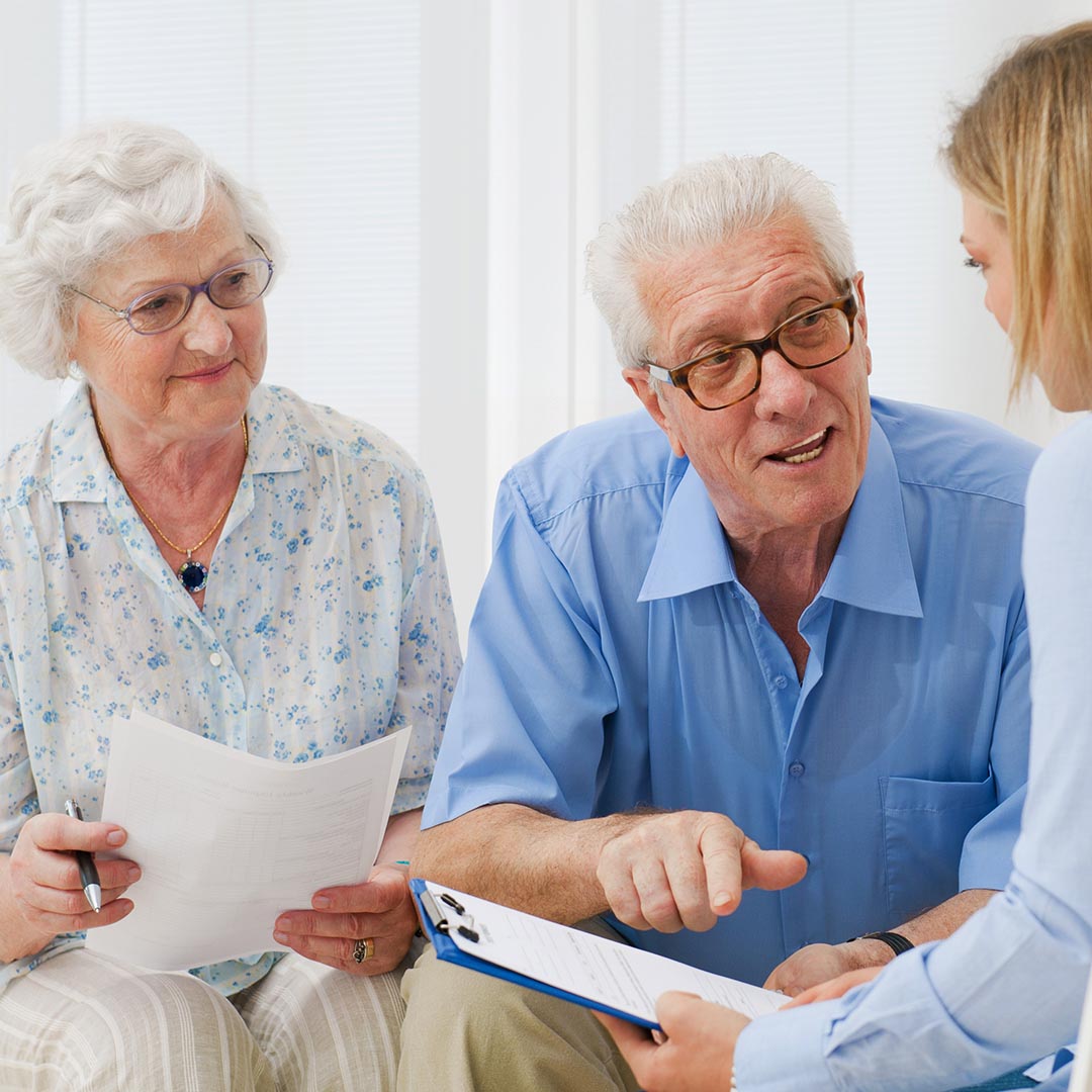 Senior couple talking to a financial advisor