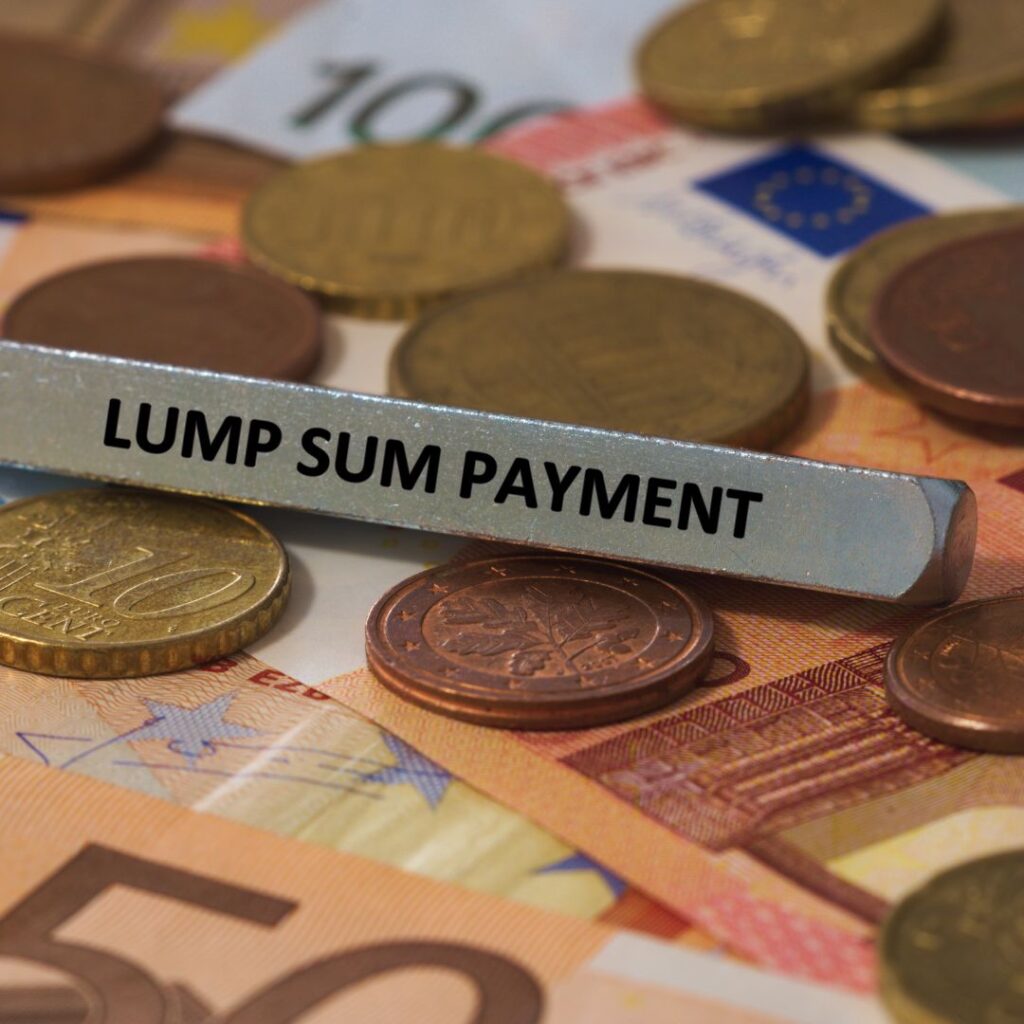 small sign on top of money that reads "Lump Sum Payment"