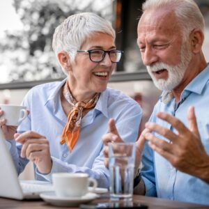senior couple on laptop