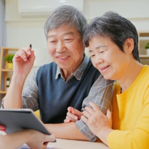 senior couple talking about life settlements