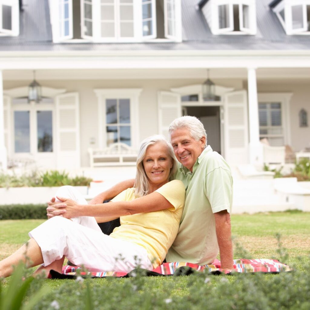 senior couple on their front yard