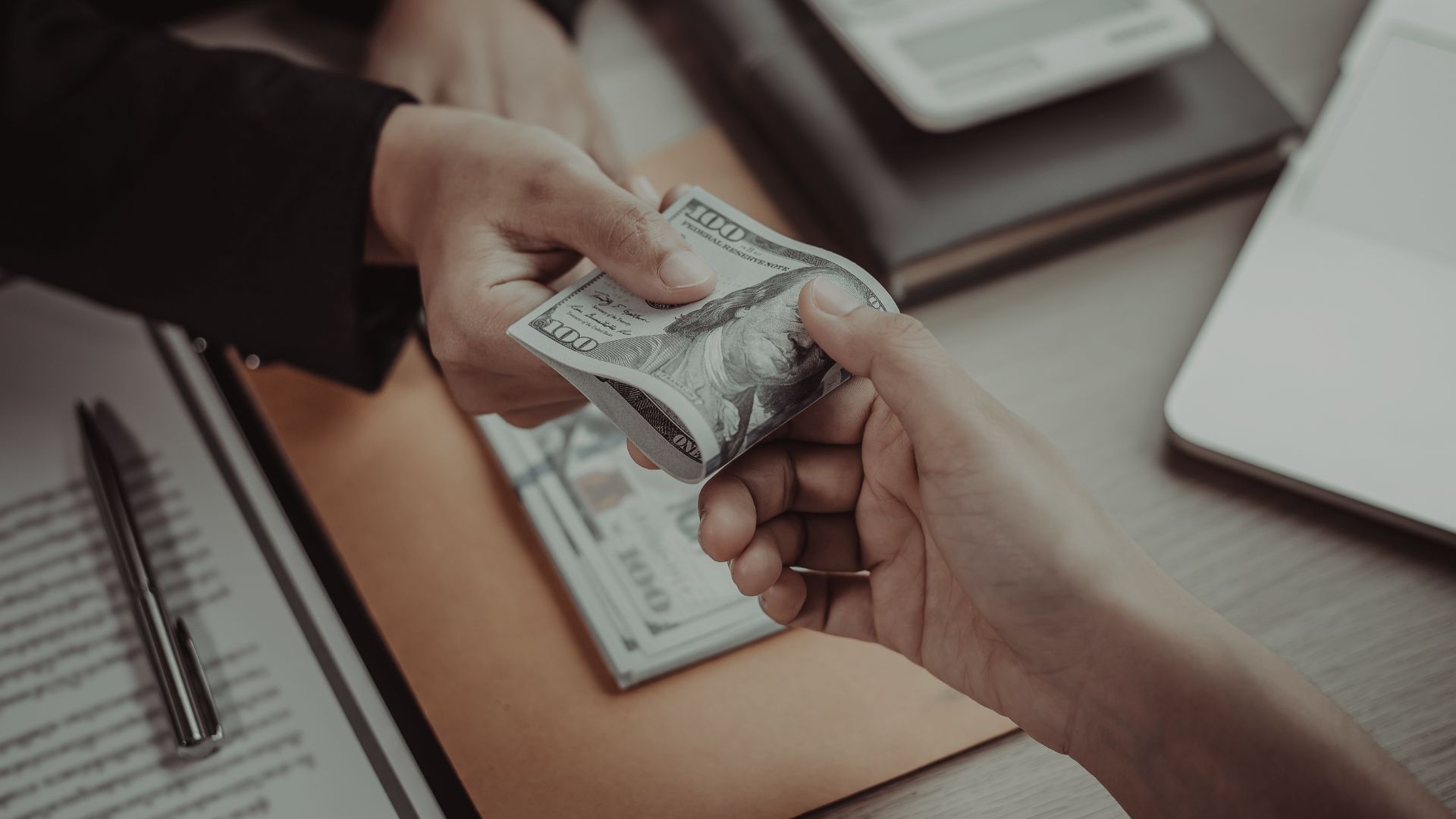 someone being handed money