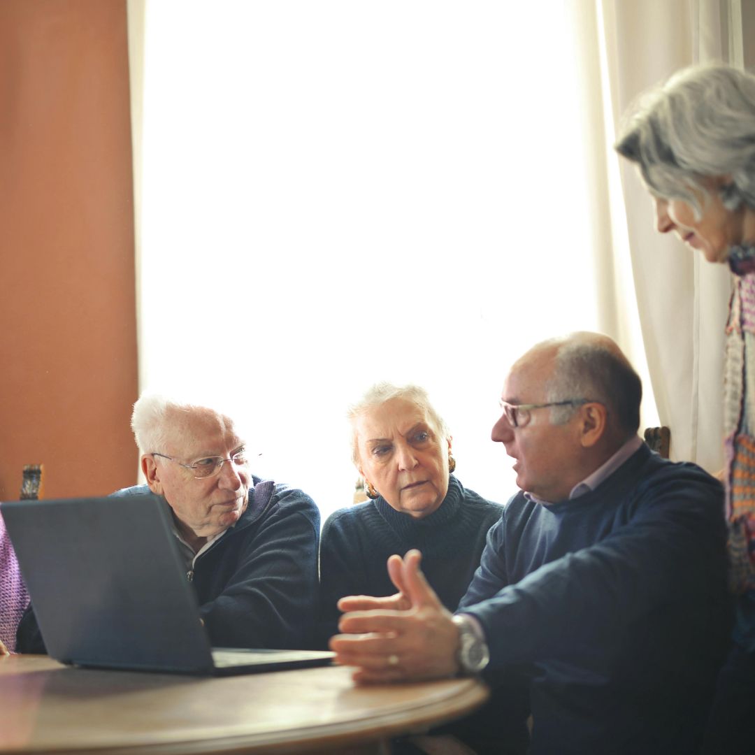 People looking at a laptop
