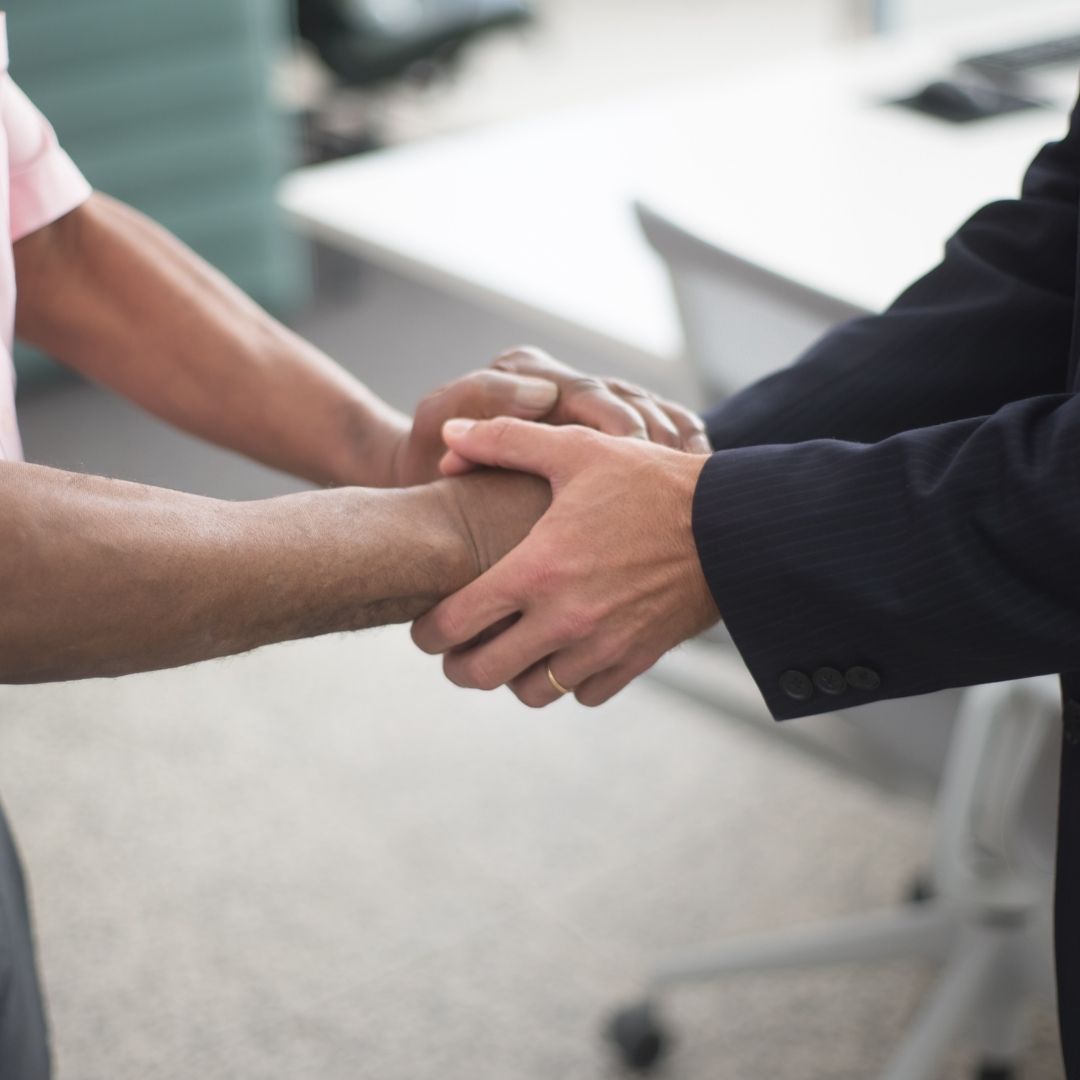 professional holding a person's hands for comfort