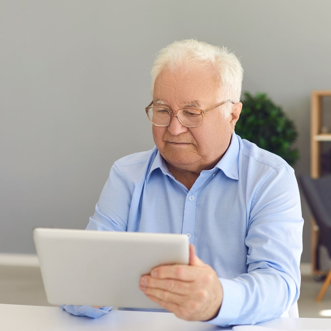 man looking at a tablet