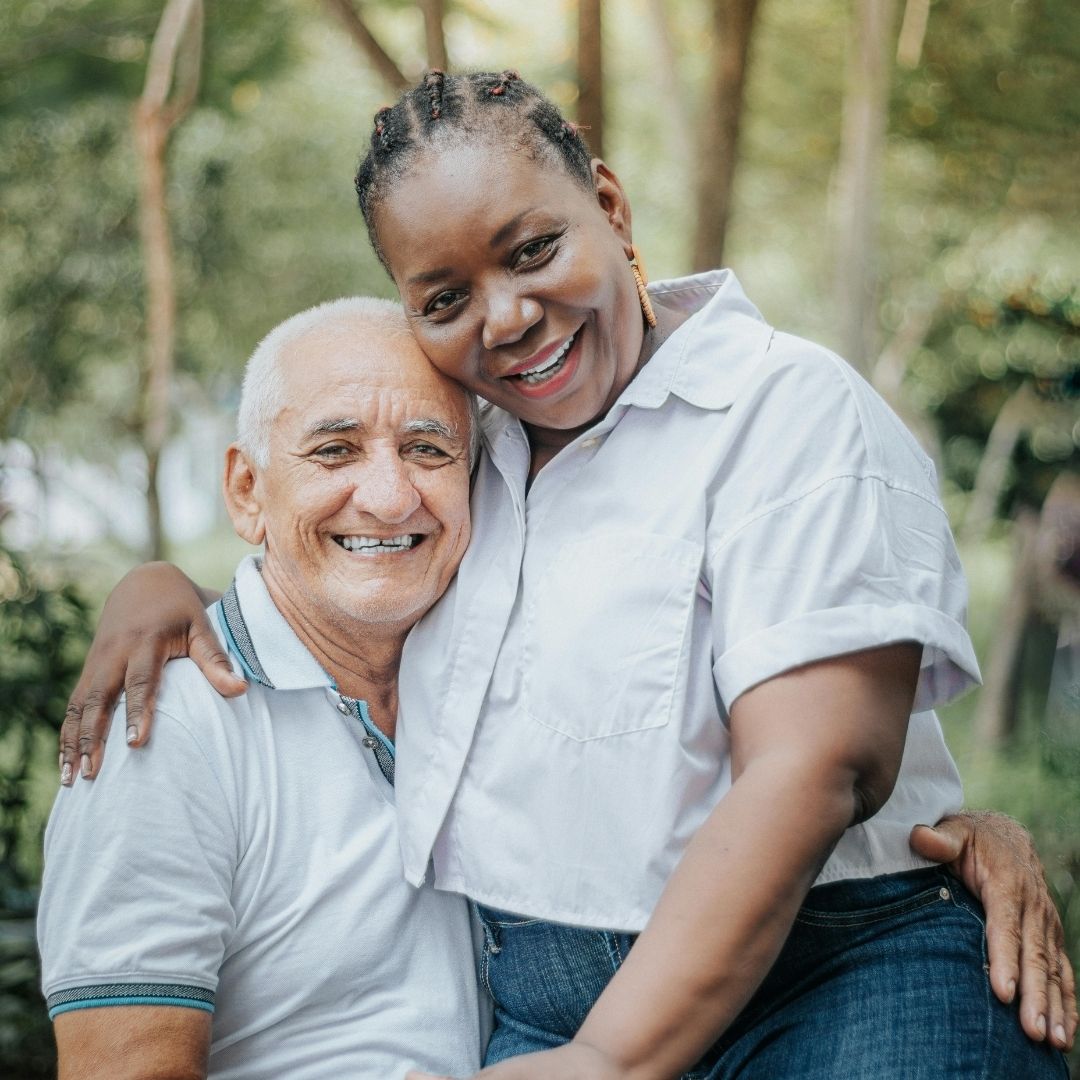 A senior couple hugging.