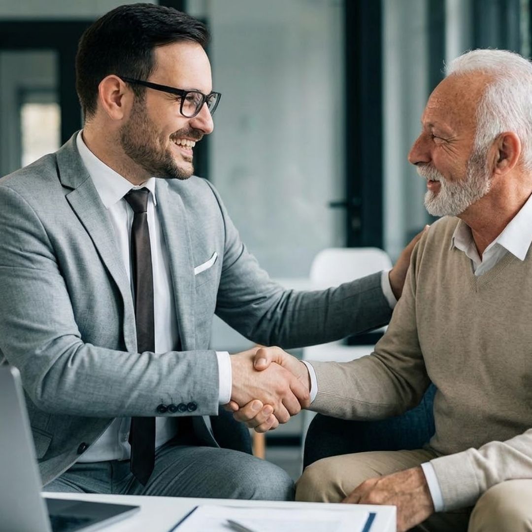 Insurance agent shaking hands with a client.