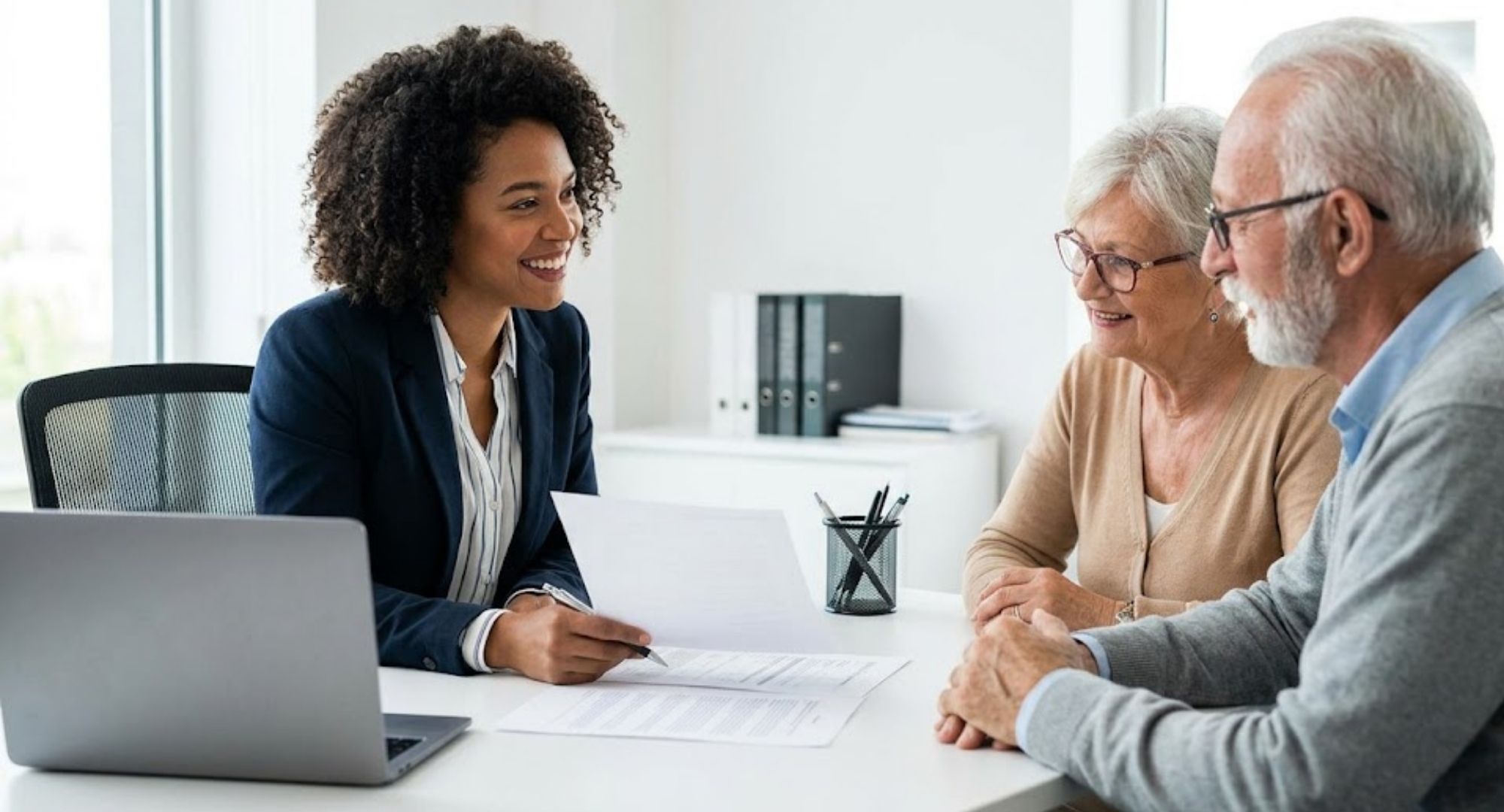 Insurance agent speaking with senior clients.
