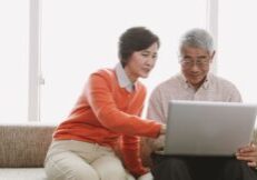 couple looking at a laptop screen