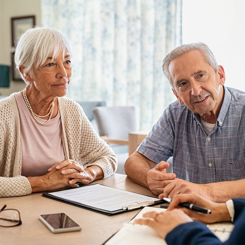 senior couple meeting with agent