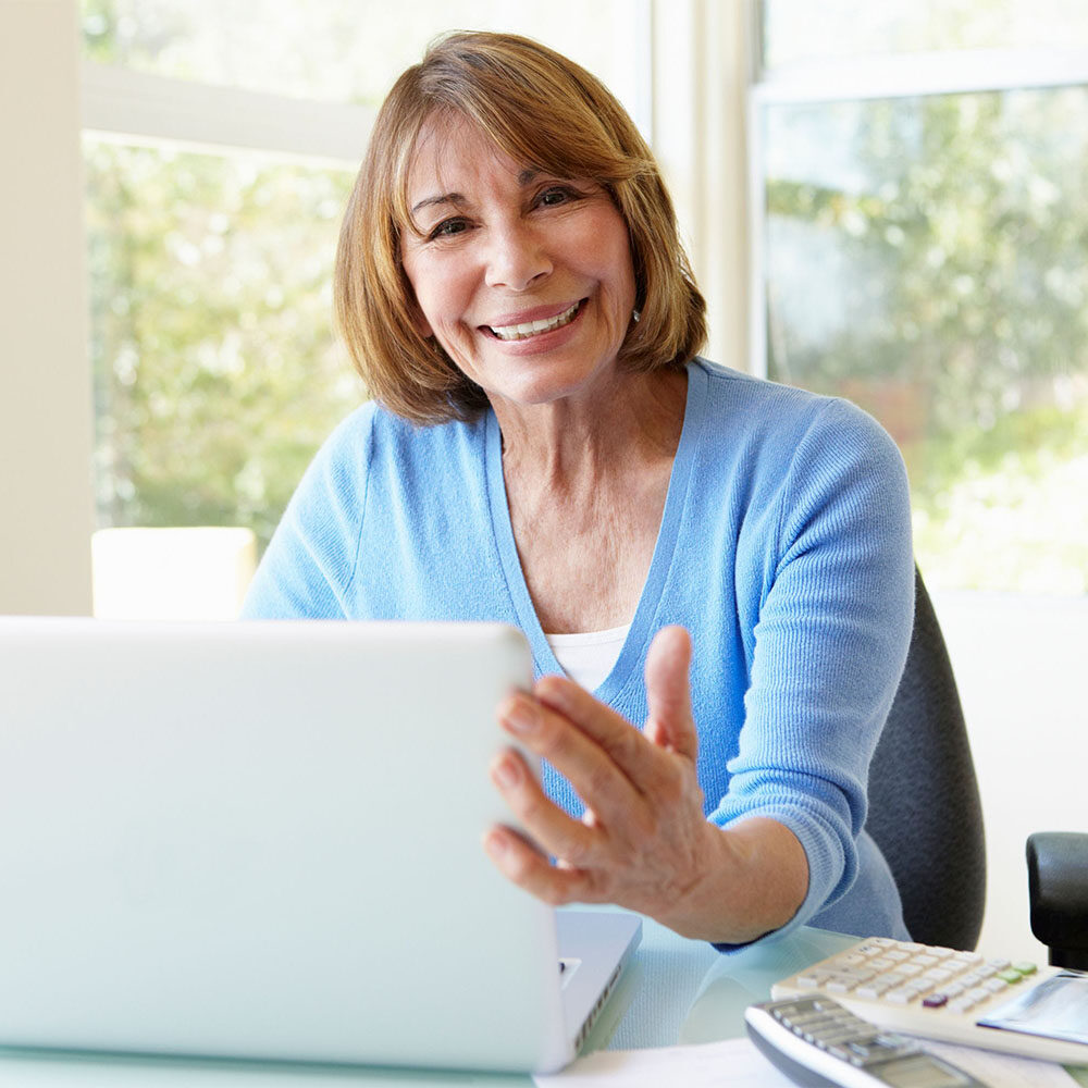 senior using laptop