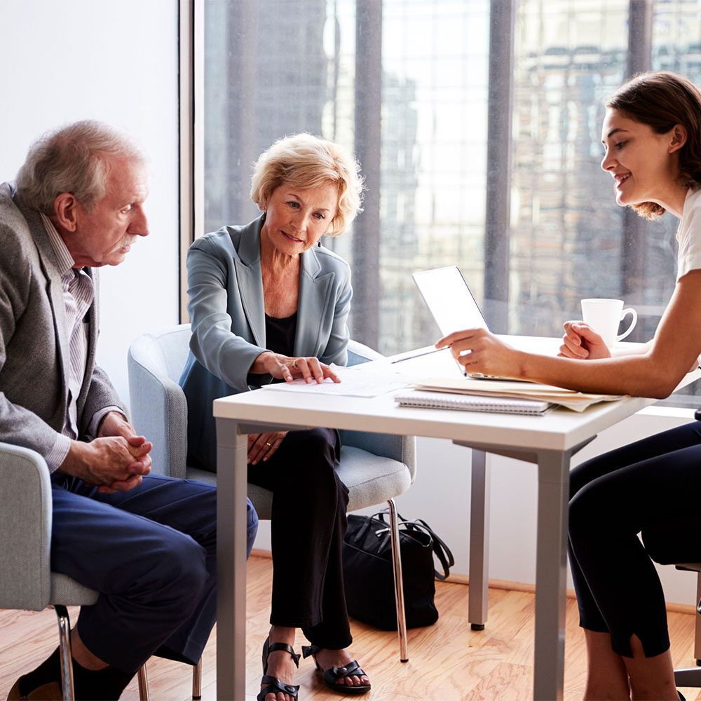 senior couple meeting with agent